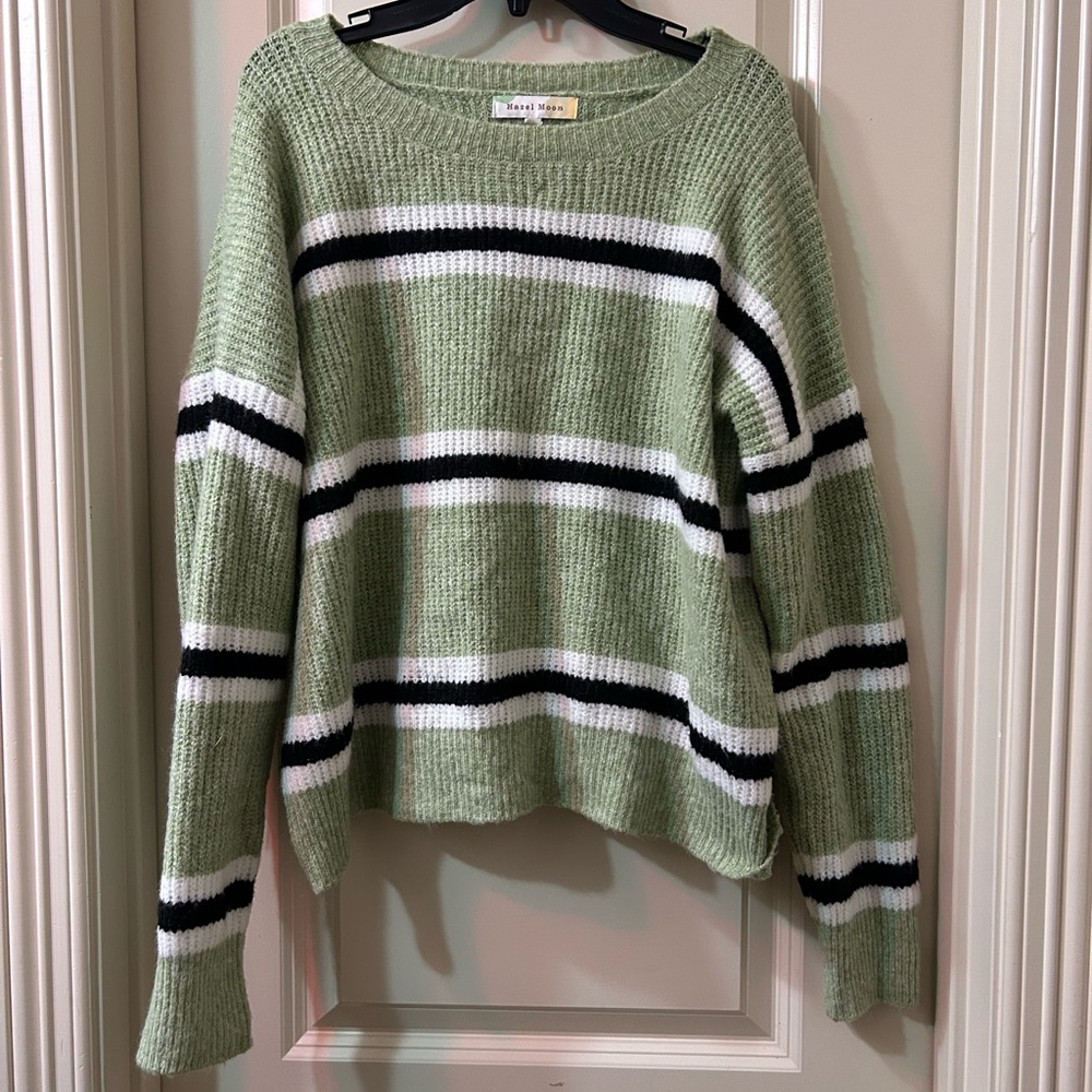 green, white, and black knit sweater.
